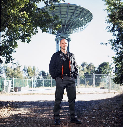 <em>Inspired by astronomer Carl Sagan's "Look but don't touch" philosophy, UC Berkeley geophysicist Greg Delory volunteers as a communications specialist for Cosmos 1--a sunlight-powered spacecraft meant for kinder, gentler cosmic voyaging. Delory is standing in front of the Berkeley Space Sciences Lab telemetry antenna that will field signals from Cosmos 1.</em>