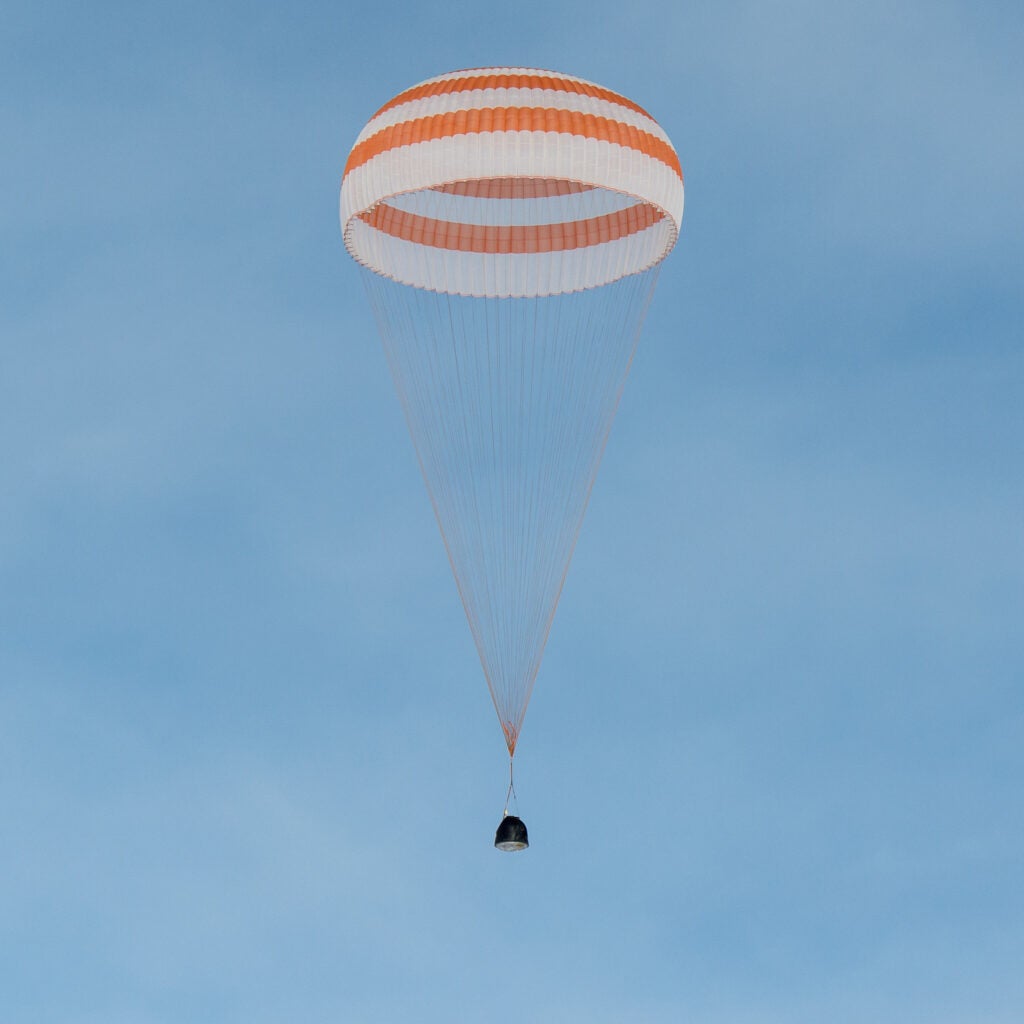 Soyuz capsule landing with a parachute