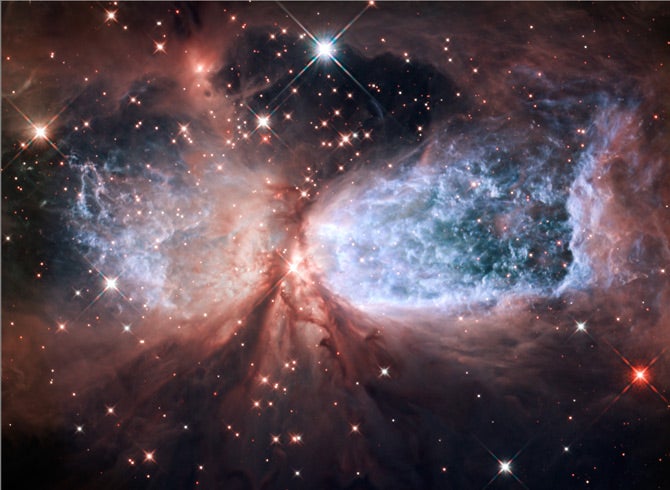 You kind of have to squint and turn your head slightly askew to see it, but this new NASA image is actually sort of seasonally appropriate. Festive, even. It's a space angel! In a bipolar star-forming region 2,000 light-years away in an isolated section of the Milky Way! See it bigger <a href="http://www.nasa.gov/mission_pages/hubble/science/snow-angel.html">here</a>.