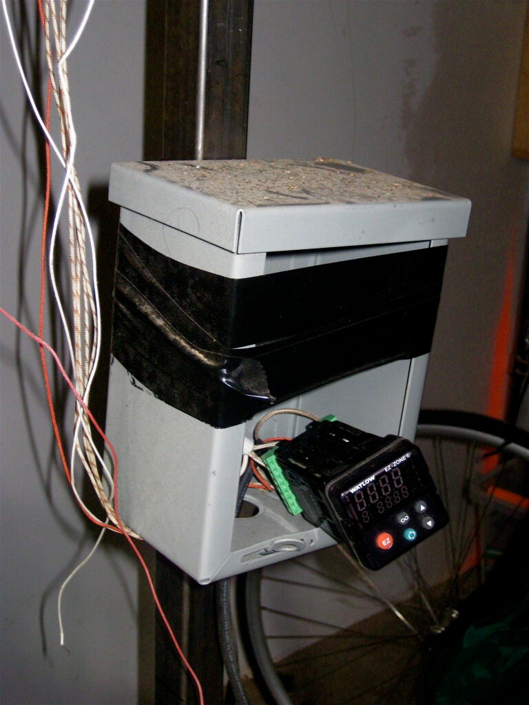 This controller -- which is a lot more high-tech than it appears in this photo -- controls the system's heat. It's connected to high-efficiency heaters that run through a vertical pipe and heat to around 1500°F, which heats the core to around 900°-1000°F. In this temperature range, the reaction produces biochar and bio-oil. The controller also turns on the system's pump, which keeps its cycle moving. re:char plans to eventually develop a unit that can be monitored and controlled remotely.