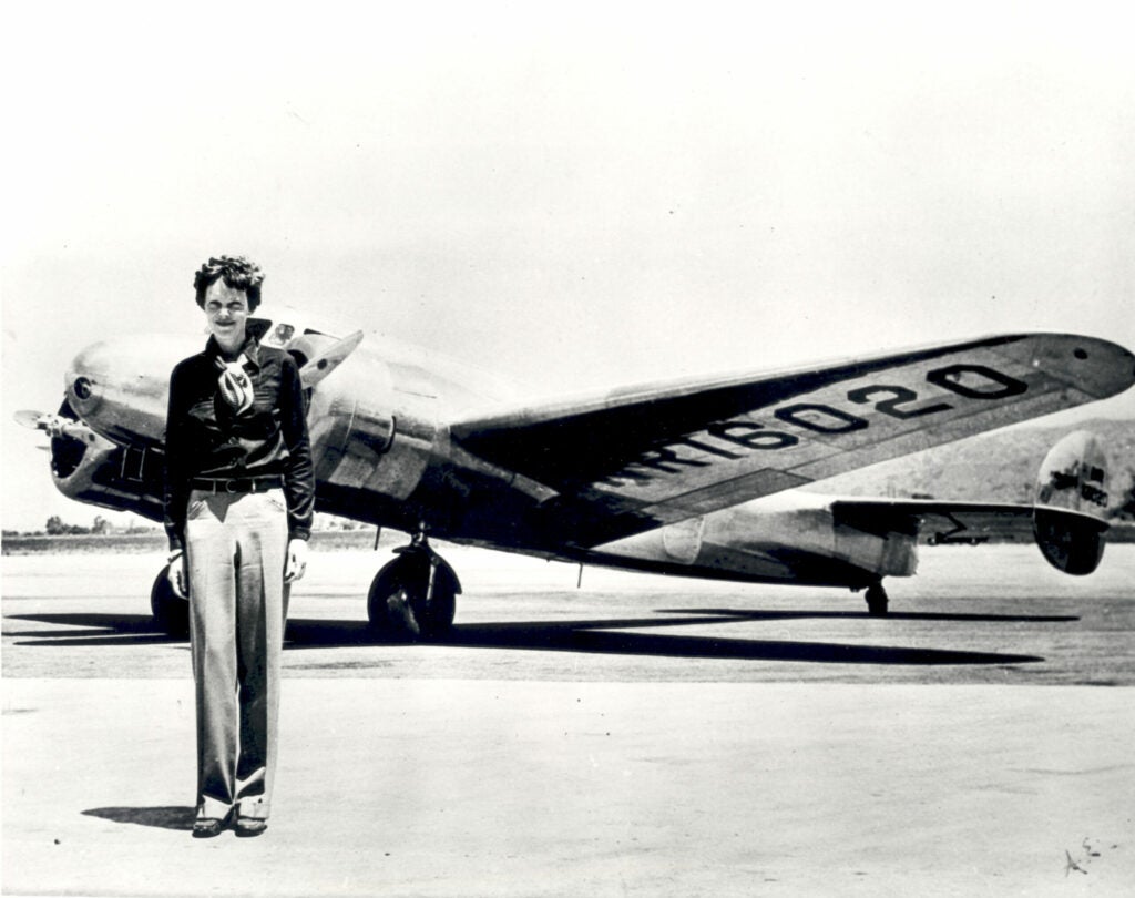 earhart in front of plane