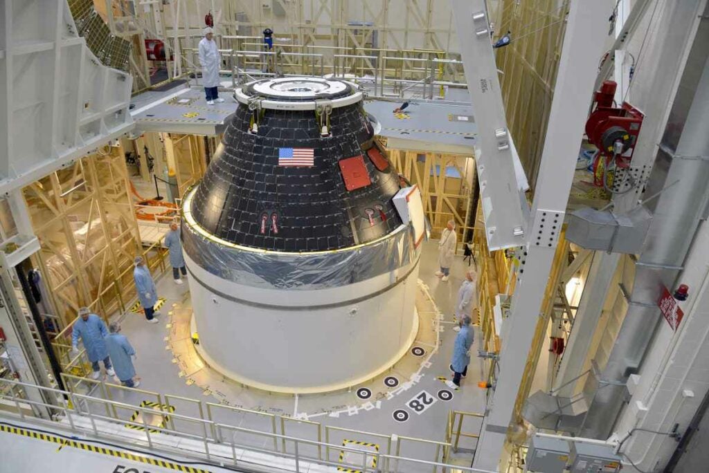 The first completed crew module for NASA’s new Orion space craft sits on top of its service module at the Kennedy Space Center in Florida. In December, Orion will ride a Delta IV Heavy rocket to 3,600 miles above Earth. <a href="https://www.popsci.com/article/science/armored-trucks-unborn-birds-go-airborne-and-other-amazing-images-week/"><em>From September 12, 2014</em></a>