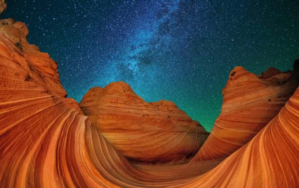 Sometimes, you just have to appreciate a beautiful landscape-- like this one, of The Wave formation in Paria Canyon-Vermillion Cliffs Wilderness in Arizona. An image like this one is actually a composite; the photographer must take a photo of the rocks with enough light, then take a picture of the clear night sky with long ISO and large aperture. Then, she can combine the two. <em>From July 18, 2014</em>