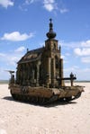 Is it a church-tank, or a tank-church? No idea! But artist <a href="http://kuksi.com/">Kris Kuksi</a> made a set of sculptures like this, and the world is a slightly stranger place for it.