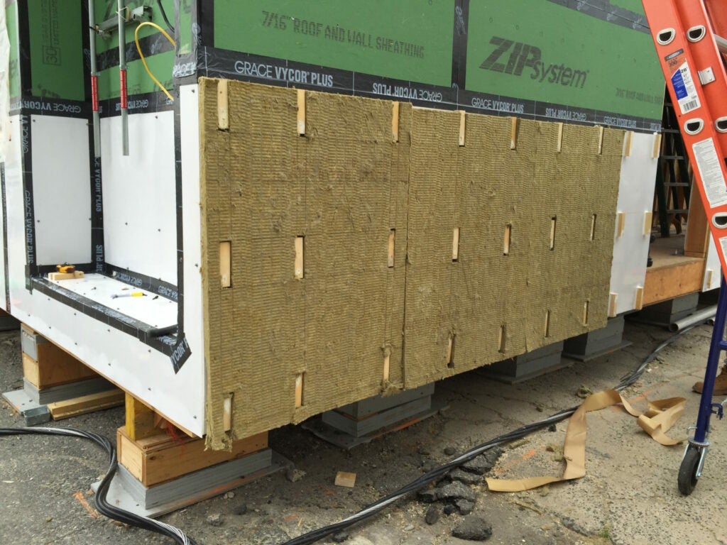 exterior insulation over a flood proof wall