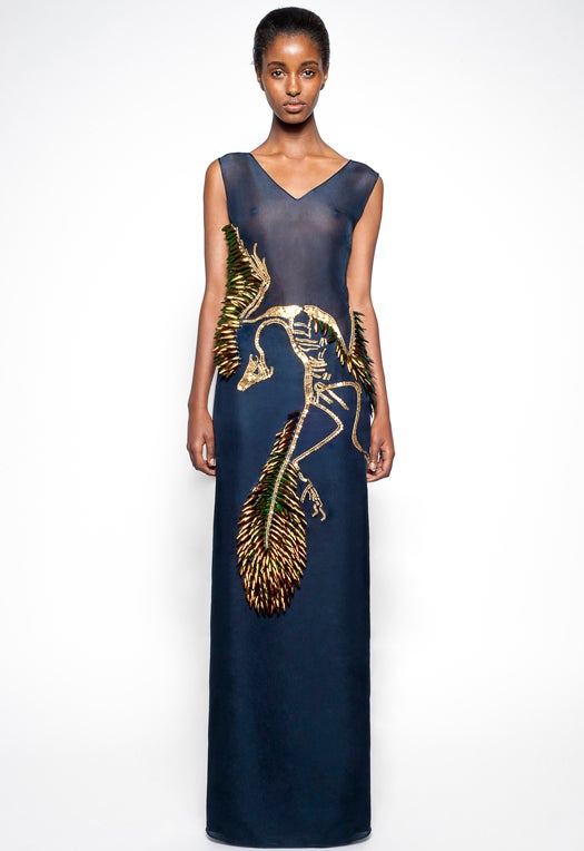 Many of Mirano's previous designs also have scientific themes. Here's a silk organza gown featuring the species that links dinosaurs to our current birds, the a(r)chaeopteryx, which lived approximately 150 million years ago. The dress is embroidered with real red beetle wings (!), gold sequins and gold bullion. It will set you back about $9,000. (Mathieu Mirano Spring/Summer 2013 collection.)