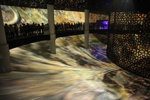 This is the world's largest IMAX screen at 1,600 square meters. It appears to be powered by multiple smaller projectors, so I'm not sure actual IMAX film is being used, but nonetheless, it's stunning. Viewers are gently rotated around the all-screen rotunda on a moving walkway, while images of Saudi oil fields and desertscapes swirl beneath.