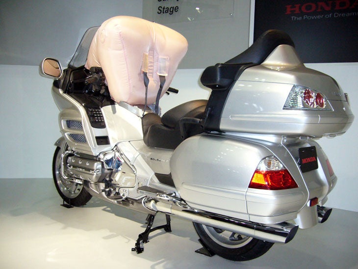 Starting in spring 2006, Honda's flagship motorcycle will be available with the world's first motorcycle airbag, able to inflate in 0.06 second and fully absorb the rider's forward energy in 0.15 second (less time than it takes to blink an eye). This innovation represents a major advance in motorcycle safety.