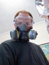 A man wearing a ventilator mask.