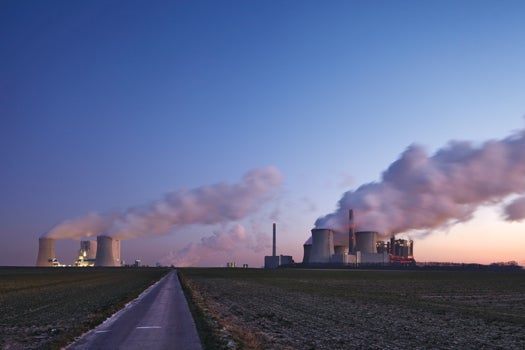Coal-burning power plants at dusk
