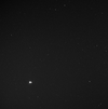 Messenger took this photo last spring of Earth and the moon from 114 million miles away.