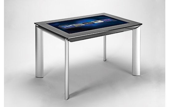 The 40-inch SUR40, co-created by Samsung and Microsoft, is a thin tabletop computer that sees and responds to whatever is placed on it. Each of the table's LCD pixels emits an infrared beam that reflects off an object back to a sensor. The processor synthesizes the sensor data to create an eight-bit image from which it can pick out shapes and large text, such as product names and numbers. Once the object is identified, the table displays related YouTube videos and other product information. Right now most apps are on the simpler side, but developers are free to program custom games and more, depending on what bar or store the table winds up in. <strong>$8,400</strong> <em>Jump to the beginning of the <a href="https://www.popsci.com/?image=66">Home Entertainment</a> section.</em> <strong>Jump to another Best of What's New category:</strong>