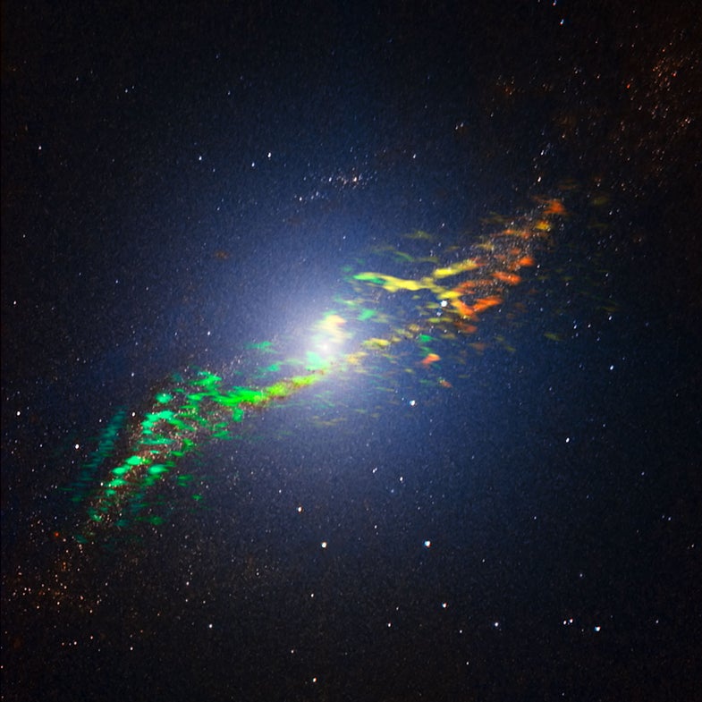 This new image of Centaurus A combines ALMA and near-infrared observations of the massive elliptical radio galaxy. The new ALMA observations, shown in a range of green, yellow and orange colours, reveal the position and motion of the clouds of gas in the galaxy. They are the sharpest and most sensitive such observations ever made. ALMA was tuned to detect signals with a wavelength around 1.3 millimetres, emitted by molecules of carbon monoxide gas. The motion of the gas in the galaxy causes slight changes to this wavelength, due to the Doppler effect. The motion is shown in this image as changes in colour. Greener features trace gas coming towards us while more orange features depict gas moving away. We can see that the gas to the left of the centre is moving towards us, while the gas to the right of the centre is moving away from us, indicating that the gas is orbiting around the galaxy. The ALMA observations are overlaid on a near-infrared image of Centaurus A obtained with the SOFI instrument attached to the ESO New Technology Telescope (NTT).