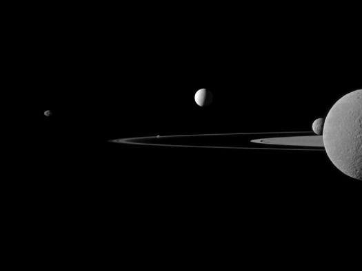 Rhea, stop making that face. Don't you want to look nice for Grandma? Cassini captured this image of Saturn with five of its dozens of moons in 2011. From left to right are Janus, Pandora (tucked within Saturn's rings), Enceladus, Mimas and Rhea.
