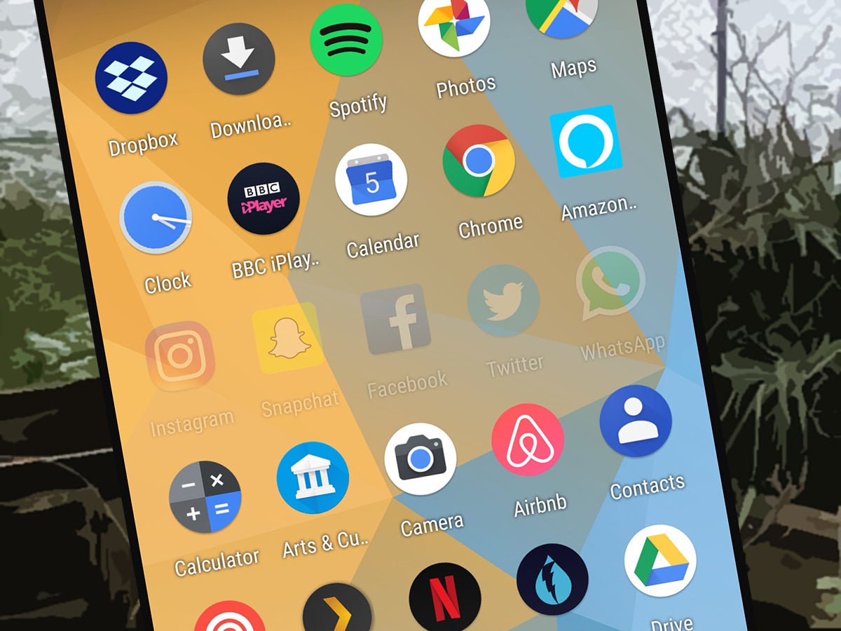 A mobile phone with a bunch of social media apps on the screen, along with other apps.