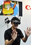 Canon, makers of fine cameras and other photography wares, showed off a new "Mixed Reality" headset. It sounds bonkers. Read more about it <a href="http://www.engadget.com/2012/06/22/canon-shows-off-its-mixed-reality/?utm_source=feedburner&amp;utm_medium=feed&amp;utm_campaign=Feed%3A+weblogsinc%2Fengadget+(Engadget)">here</a>.