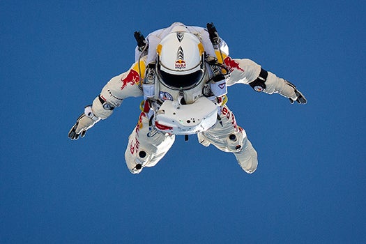 BASE jumper Felix Baumgartner plummets toward Earth in a spacesuit during a test skydive. The grand attempt will be a jump from 120,000 feet.