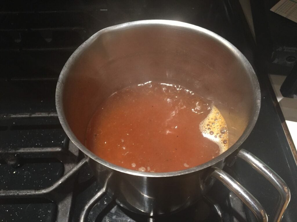 Boiling water with popcorn kernels in it