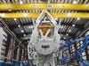 The SpaceX Falcon 9 rocket will launch this Sunday. Here technicians attach the "dragon capsule" portion to the rocket.
