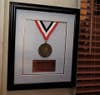 Designers scored a vintage original 1983 Mathletes medal to hang on Charlie's office wall.