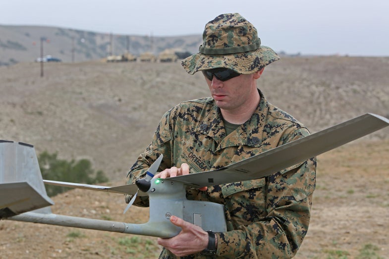 Staff Sgt. Juan-Ricardo Ortega, an infantry unit leader with Marine Corps Security Forces Battalion, inspects an unmanned aerial vehicle after a landing during a UAV training course aboard Camp Pendleton, Calif., Jan. 31, 2014. The UAV course is two weeks long and focuses on familiarizing Marines and sailors with the equipment primarily through practical application. (U.S. Marine Corps photo by Lance Cpl. Keenan Zelazoski/ Released)