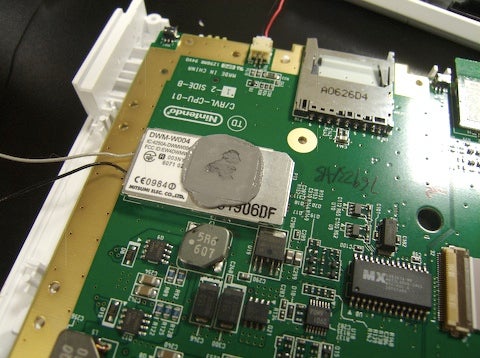 The Wi-Fi module with thermal grease. The SD card slot is also visible.