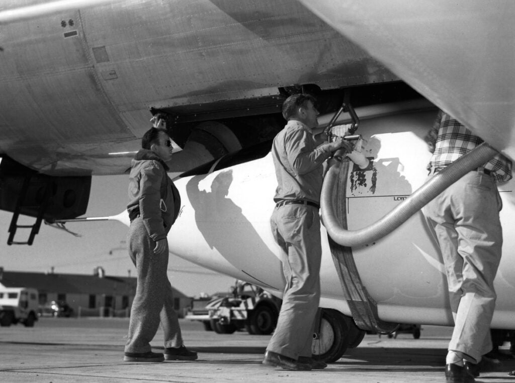 Ground crews servicing the X-1 in 1951. This time with shirts on. Fittingly button front and plaid shirts.