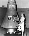 Jerrie Cobb poses next to a Mercury Capsule