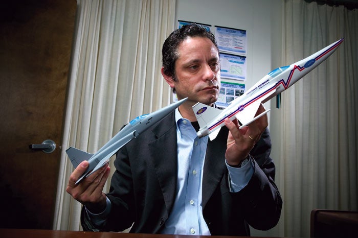 Charles Boccadoro holding two models of airplanes