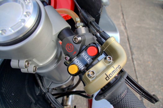 Unlike internal-combustion racers, electrics are very quiet, necessitating the fitment of a horn to warn other bikes they're about to be passed.