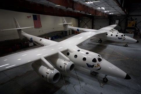 <em>WhiteKnightTwo</em> is designed to carry a smaller craft, <em>SpaceShipTwo</em>, up to 48,000 feet and release it so it can fire up its rockets and carry paying passengers to the edge of space and back.