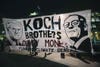 Charles and David Koch on a protester's poster