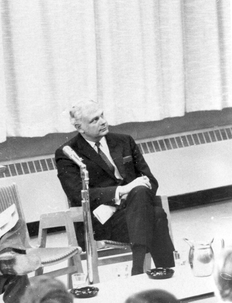 Paul Hellyer sitting in a chair and looking into the distance