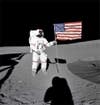 Al Shepard raises the American flag during Apollo 14