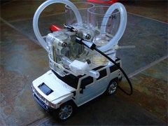 A white RC Hummer with a fuel cell on top.