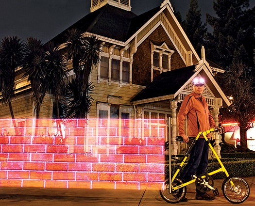 A computer-controlled strip of LEDs attached to Phillip Burgess's bike created this eerie brick wall as he rode by.