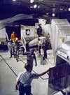 Not knowing whether or not the crew picked up any space-diseases on the Moon, NASA had the astronauts put on biological containment suits right away. Here they are waving and walking to their quarantine facility on board the USS Hornet.