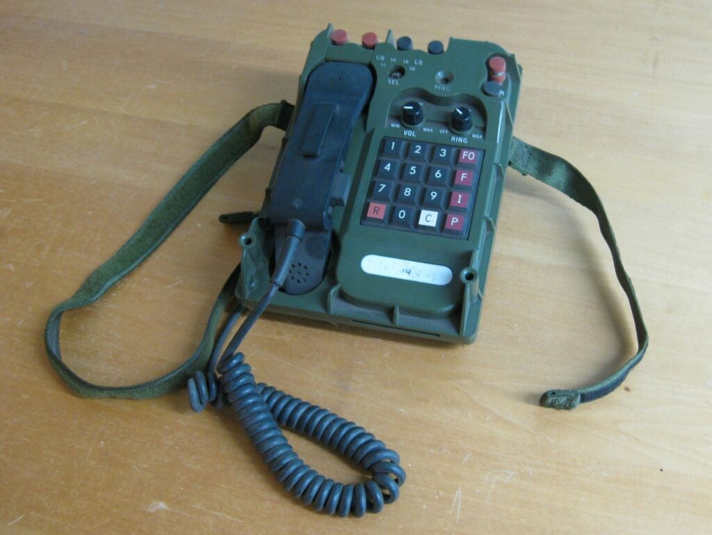 This is a PA-1042 Field Telephone. It was used, to my understanding, as part of digital field telephone networks throughout the 90s. The technology interests me because they encode Analog to Digital right in the handset. The design interests me because it is a technologically complex device with a minimum of controls, and which could almost certainly be used as a hammer.