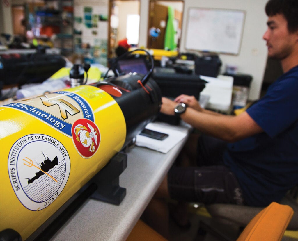 Scripps engineer Billy Middleton offloads data from the Remus AUV after each mission.