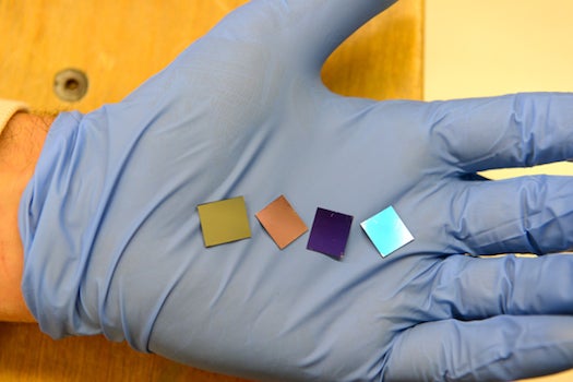 Consisting of billions of gold nanodots, these four squares are the thinnest light absorbers ever built.