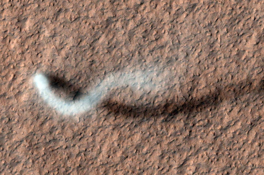 Massive dust storms, similar to this serpent-like dust devil, plague the landers and rovers that humans have tried to send to Mars over the decades.