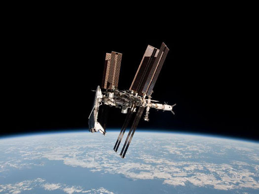First-Ever Photos of Space Shuttle Docked At Space Station