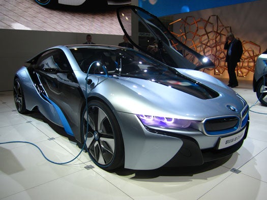 The sleek looking gas-electric i8 sports coupe is built around the same carbon fiber 'life module' idea as the i3. Kim, said the high strength of the carbon fiber enabled the massive hinged door. The i8 is about 'efficiency, performance, technology and emotion are all in perfect balance.' said Kim. The i8 is set to go on sale in 2014.