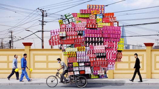 For the photo series "<a href="http://www.alaindelorme.com/">Totems</a>," Alain Delorme captures the insane loads carried by migrant workers in China, then Photoshops them to increase the proportions even more. Seems like it could almost be real, though, if you just tweak physics a <em>tiny bit</em>.