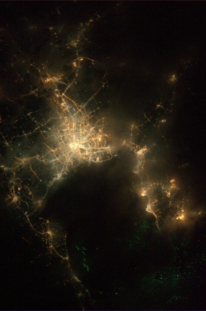 Like many cities, Bangkok's skyline doesn't go to sleep, which adds to the light pollution that makes it so hard to see stars from Earth. You can see that from space in this photo: Here is Bangkok, with veins of city lights streaking through ghostly cloud cover, taken on August 15, 2013.