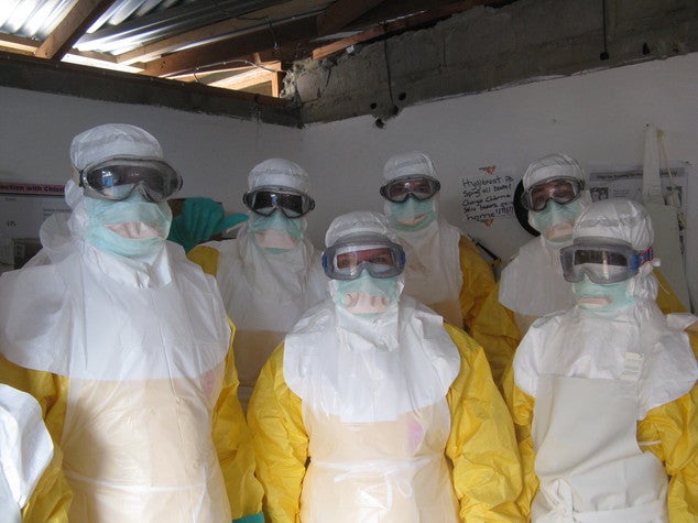 In this undated handout photo provided by Medecins Sans Frontieres, local staff and healthcare workers for Doctors Without Borders, wear Ebola protection equipment in Liberia. For doctors and nurses fighting Ebola in West Africa, working in head-to-toe protective gear in muddy health clinics is often the least of their problems, as many also struggle to convince people they are there to stop Ebola, not spread it. (AP Photo/MSF)