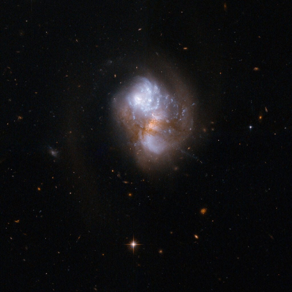 IC 1623 is an interacting galaxy system that is very bright when observed in the infrared. One of the two galaxies, the infrared-bright, but optically obscured galaxy VV 114E, has a substantial amount of warm and dense gas. Warm and dense gas is also found in the overlap region connecting the two nuclei. Observations further support the notion that IC 1623 is approaching the final stage of its merger, when a violent central inflow of gas will trigger intense starburst activity that could boost the infrared luminosity above the ultra-luminous threshold. The system will likely evolve into a compact starburst system similar to Arp 220. IC 1623 is located about 300 million light-years away from Earth.