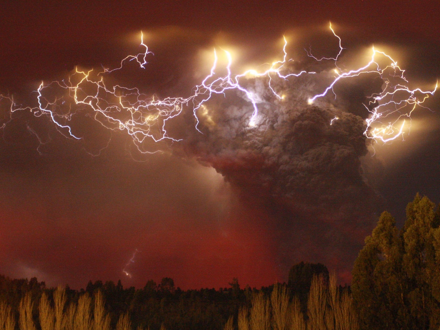 Lightning flashes around the ash plume above the Puyehue-Cordon Caulle volcano chain near Entrelagos on June 5, 2011.