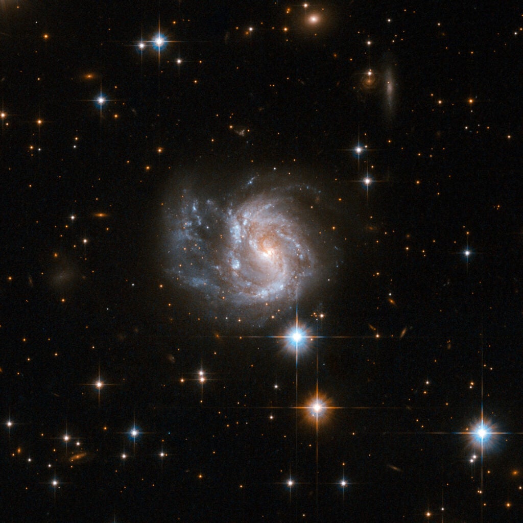 IRAS 20351+2521 is a galaxy with a sprawling structure of gas, dust and numerous blue star knots. IRAS 20351+2521 is located in the constellation of Vulpecula, the Fox, 450 million light-years away from Earth.