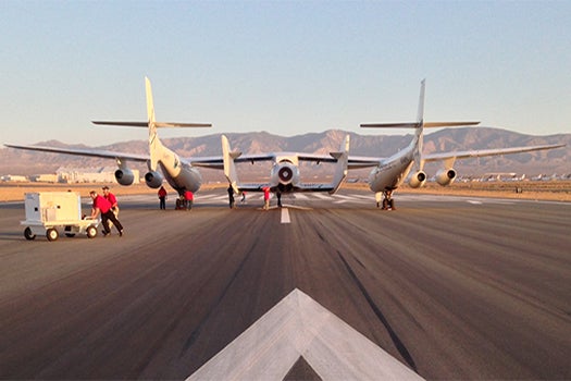 WhiteKnightTwo and SpaceShipOne on the runway prior to Virgin Galactic's first rocket-powered spaceflight on April 29, 2013.